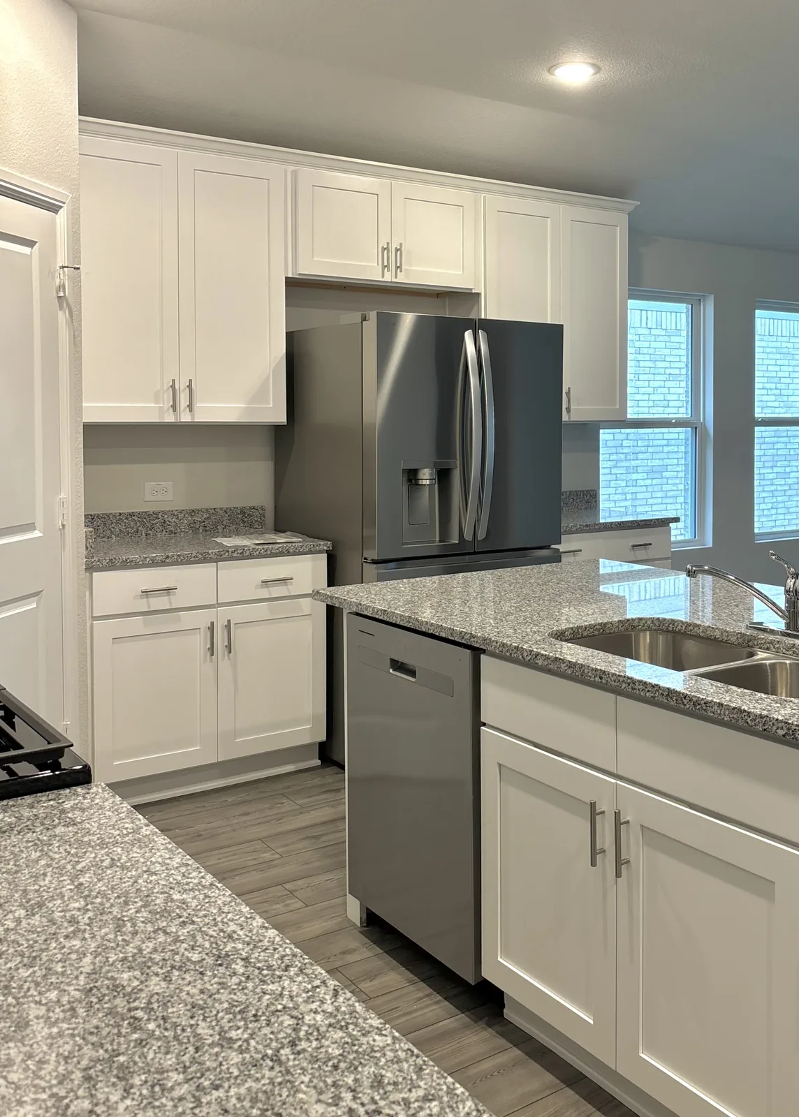Bright white kitchen cabinetry with crisp painted surfaces