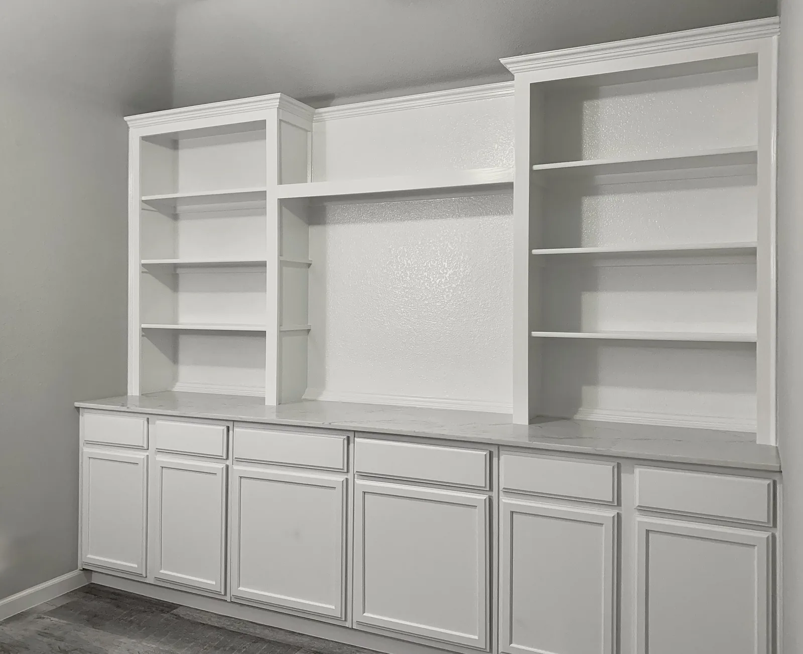 White built-in cabinets and shelving with a smooth finish